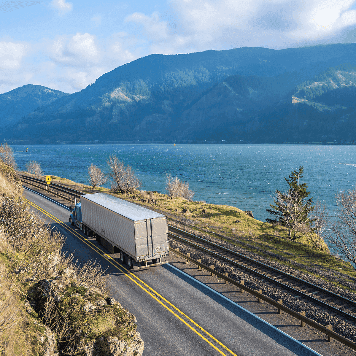 Truck on highway by water